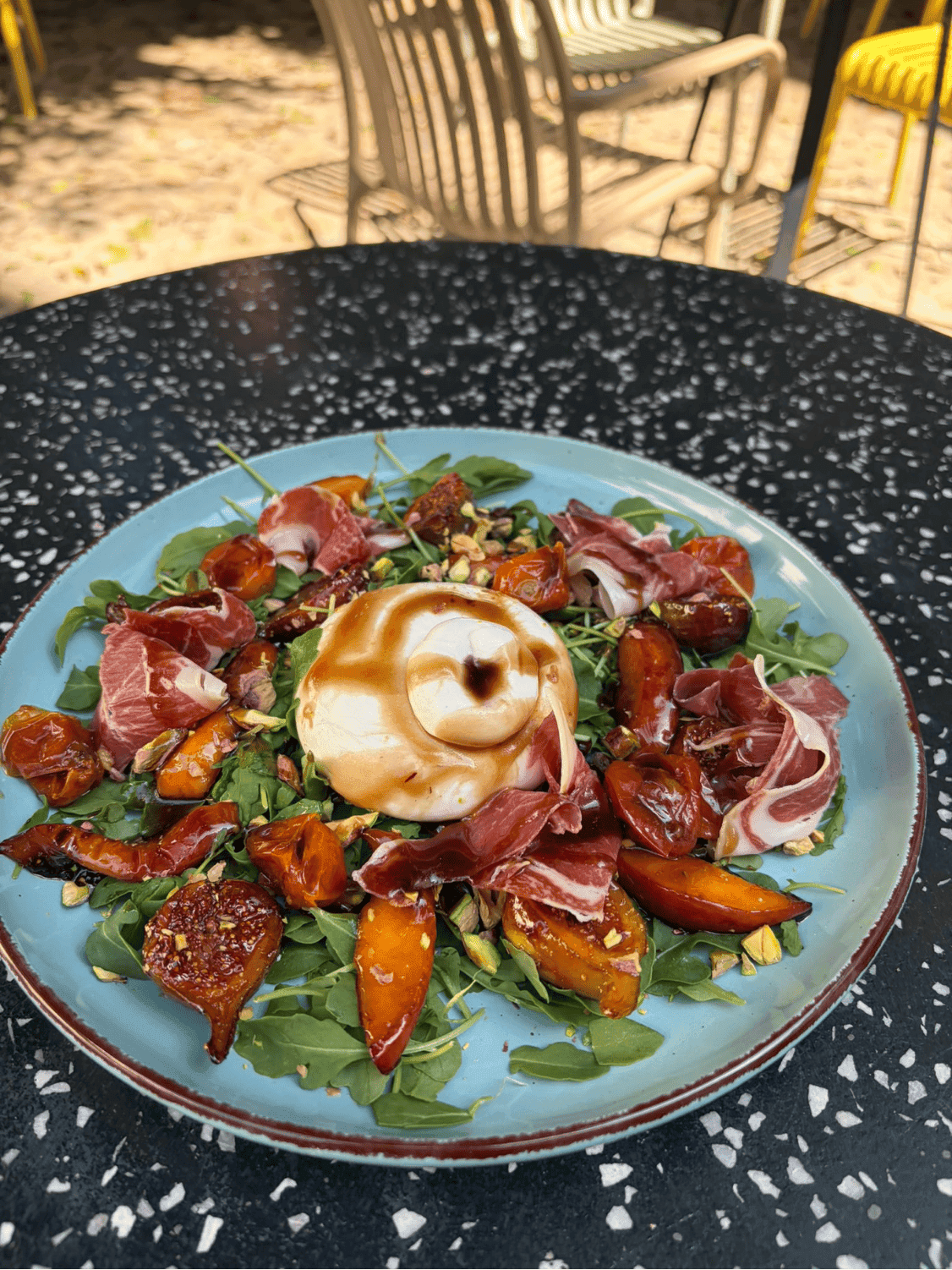 La Dolce: creamy burrata with seasonal fruit, Iberian ham and pistachios