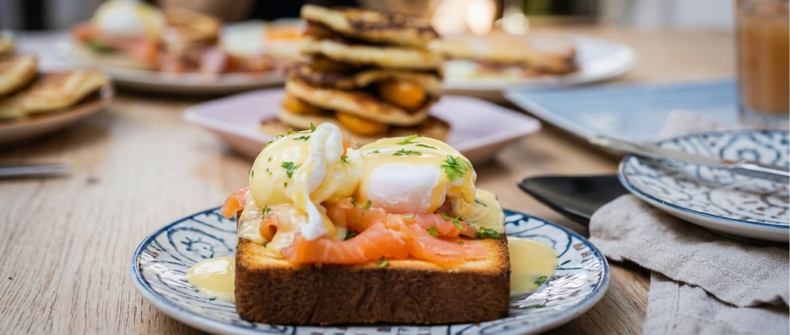 Eggs Benedict with smoked salmon on brioche toast at the brunch of La Despensa de Eva, Sant Feliu de Llobregat